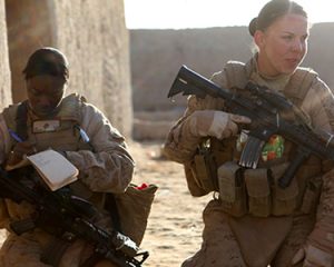 2 female marines conduct a security patrol in Afghanistan, 